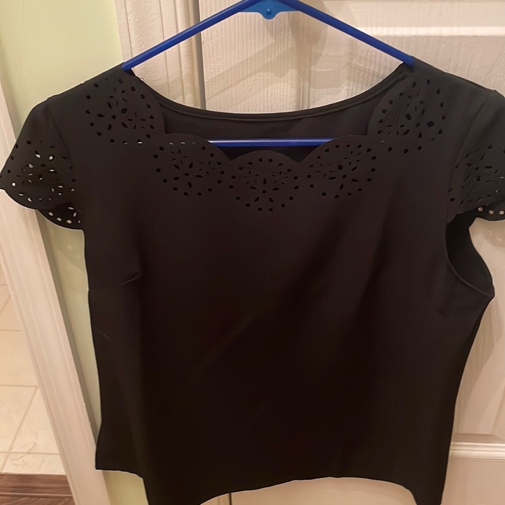 NWOT black lightweight top with cut out trim on neck and short sleeves